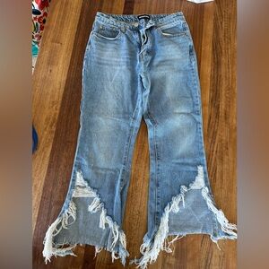Fun distressed bottom flare Jean. Mid rise